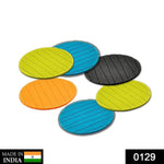 Six plain round silicone drink coasters neatly stacked, ready for use.