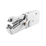 The  mini electric sewing machine held in hand, illustrating its portable scale.