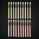 Detailed view of the ultra-soft bristles on a plastic toothbrush, designed for gentle yet effective cleaning.