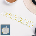 Set of six transparent adhesive hooks displayed neatly, ready for home organization.