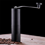 Siplix portable stainless steel manual coffee grinder standing upright.
