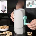 Manual hand-crank peanut sheller machine with a transparent collection tray.