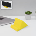 Compact plastic mobile phone holder stand angled for stable smartphone support on desk