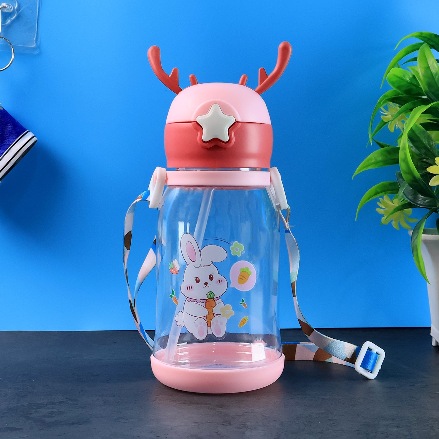 Kids cartoon water bottle with playful star cap and antler design