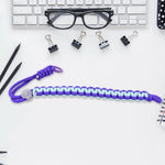 Multicolor adjustable phone wrist strap lanyard displayed on a clean surface.