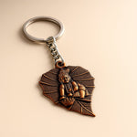 Bal Krishna keychain with antique bronze finish and peepal leaf design