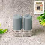 Salt & pepper shakers made of clear acrylic on dining table for precise seasoning