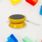 Front view of the plastic commander container filled with a variety of small toys.