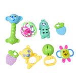 Baby holding an orange and green multi-textured teether, soothing gums