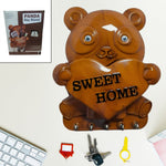 Cute plastic Panda Key Holder with five hooks mounted on a white wall.