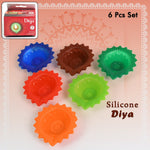 Top-down view of the attractive silicone diya set in varied colours, ready for Diwali.