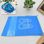 Portable waterproof shoe bag for travel, shown folded compactly on a white surface.