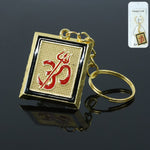 Golden metal Om Trishul keychain front view showcasing intricate spiritual design