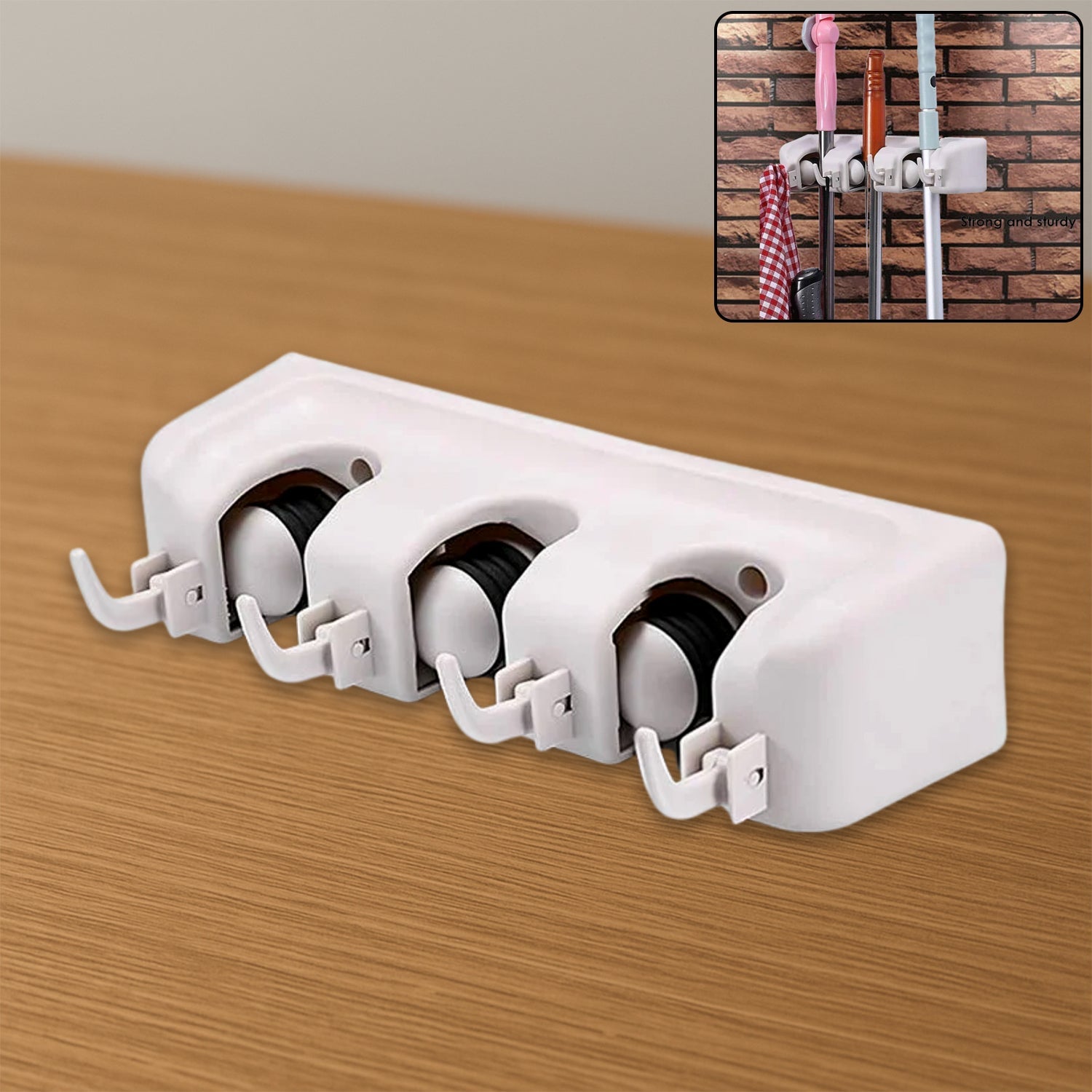 Close-up of the GlimmerHome 3-layer mop and broom holder showing grip mechanism.