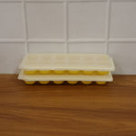Easy release silicone ice cube maker with 24 compartments and lid.