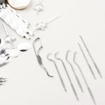 The compact AuriGlam 7-in-1 dental hygiene kit with all tools visible.