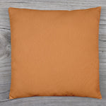 A beige couch pillow cover with an invisible zipper closure for easy use.