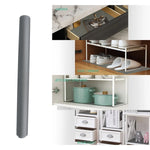 Roll of anti-slip mat being placed inside a drawer for protection and grip.