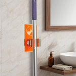 Wall clip holder for mops and brooms