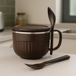 Overhead shot of insulated lunch bowl 650ml with lid and integrated cutlery spoon.