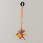 Dragon pop fidget toy with carrying strap on white background
