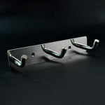 Polished metallic 3 hook rack mounted on bedroom wall