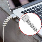 Single black spiral cable protector securely installed on a mobile charger cord.