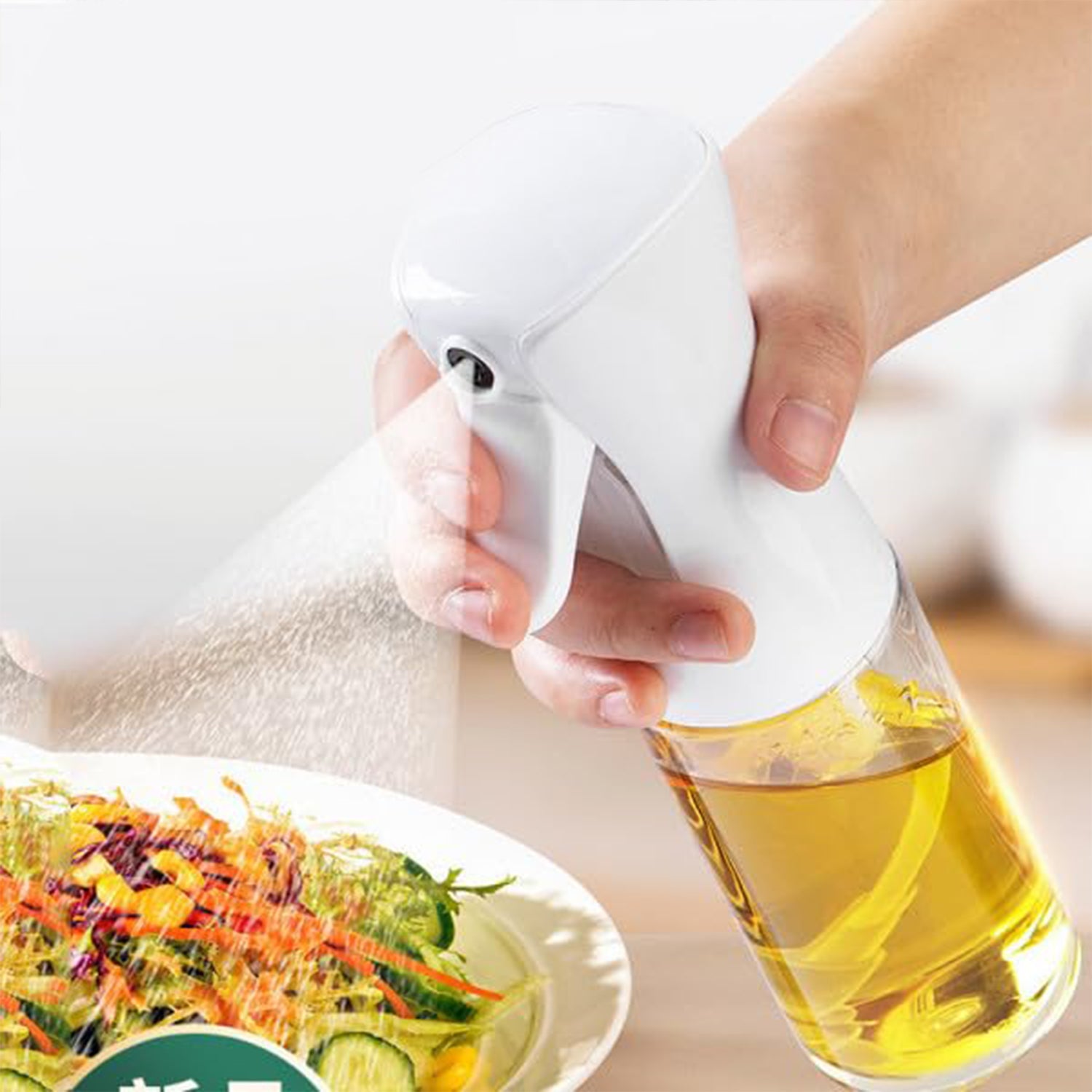 Elegant glass oil spray bottle on a kitchen counter, ready for use.