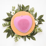 Waterproof heart-shaped silicone facial brush for gentle skin cleansing.