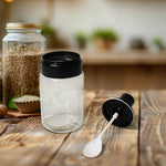  glass oil dispensers and spice jars neatly arranged in a modern kitchen.