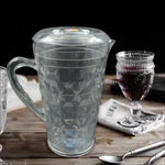 Angled view of the Mocktail PET Plastic Jug, highlighting its elegant diamond-cut design and clear material.