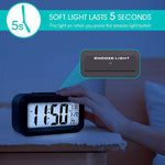 Close-up of soft glow LCD desk alarm clock with temperature display