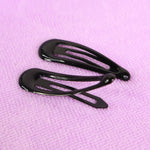 Metal hair clips displayed on white background showing assorted trendy colors