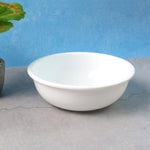 Plastic serving bowl 6 inch with deep round white design on kitchen counter