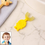 Baby toothbrush shaped like a cute cartoon duck with soft silicone bristles