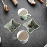 A person enjoying chai and snacks with the versatile ceramic tea and coffee cup set.
