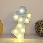 Rear view of the LED angel light, showing its battery compartment and sturdy base.