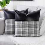 Close-up of a pair of Styleva Leather & Cotton Pillow Covers with elegant texture.