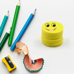 Four vibrant smiley emoji erasers, perfect for kids' school supplies.