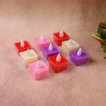 Close-up of multicolor square LED tealight candle showing flickering flame effect