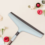 Close-up view of the 16-inch Ganesh floor wiper head and mild steel handle.