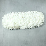 Freshly washed dust mop refill head drying naturally.