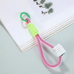 Close-up of the robust nylon phone wrist strap attachment mechanism.