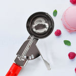 Quick-release lever ice cream scoop for clean dessert portions