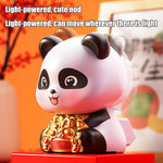 Animated solar panda showpiece demonstrating its shaking head feature.