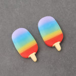 Cute popsicle erasers placed on a notebook, ready for schoolwork.