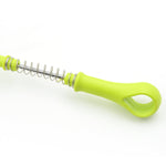 Top-down view of the potato masher, highlighting its unique perforated mashing plate.