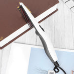 Side view of the electric hair straightening comb showing temperature controls.