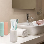 Blue travel toothbrush holder securely containing a toothbrush and toothpaste.