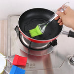 Silicone pastry brush and spatula, safe for non-stick surfaces.